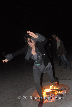 Woman jumping over fire (March 15, 2011) - by QH