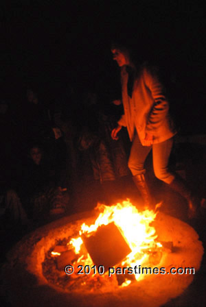 Woman jumping over fire (March 15, 2011) - by QH