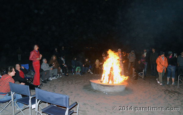People gather around bonfire, LA (March 18, 2014) - by QH