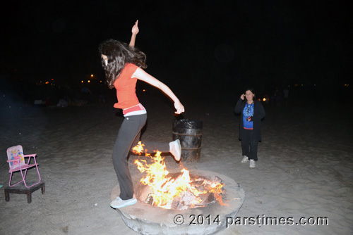 Girl jumping over the fire, LA (March 18, 2014)  - by QH