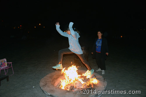 Girl jumping over the fire, LA (March 18, 2014)  - by QH