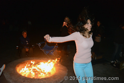 Woman smiles after jumping over the fire, LA (March 18, 2014)  - by QH