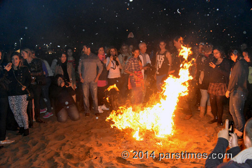 People gather around bonfire, LA (March 18, 2014)  - by QH