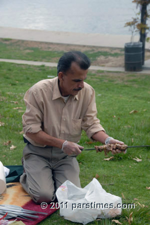 Man preparing Kabob - (April 3, 2011) - by QH