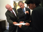 President George W. Bush and Vice President Dick Cheney and National Security Adviser Condoleezza Rice in the Outer Oval Office of the White House - WH Photo September 12, 2001