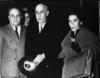 Prime Minister Mohammad Mossadegh of Iran accompanied by Dr. Gholem Hossein Mossadegh and Zia Achraf Bayat.