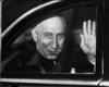 Prime Minister Mohammad Mossadegh of Iran leaving for the Iranian Embassy.