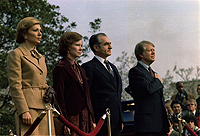 Rosalynn Carter and Jimmy Carter host welcoming ceremony for the state visit of the Shah of Iran and the Shahbanou of Iran., 11/15/1977 - ARC Identifier: 176849.