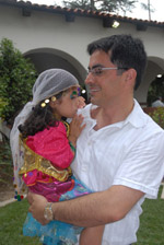 A loving Iranian father holding his daughter - Santa Anna  (July 30, 2006) - by QH