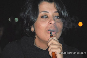 Persian woman smoking the hookah (March 18, 2006) - by QH